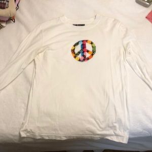 white peace sign shirt